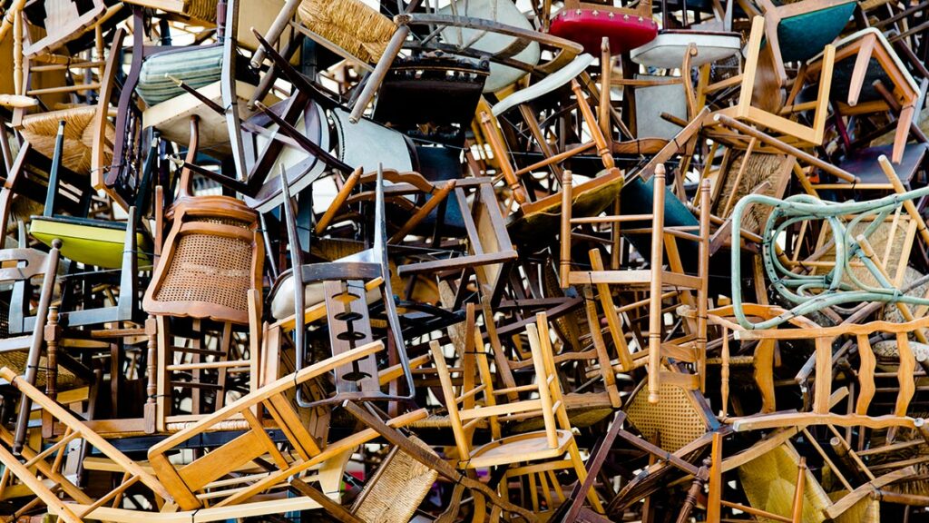 A chaotic pile of chairs represents a guide to running effective meetings