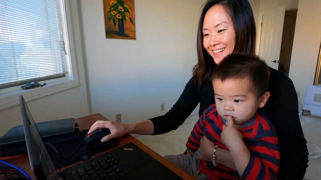 Rena Yi of LinkedIn and her son sit at her home workstation